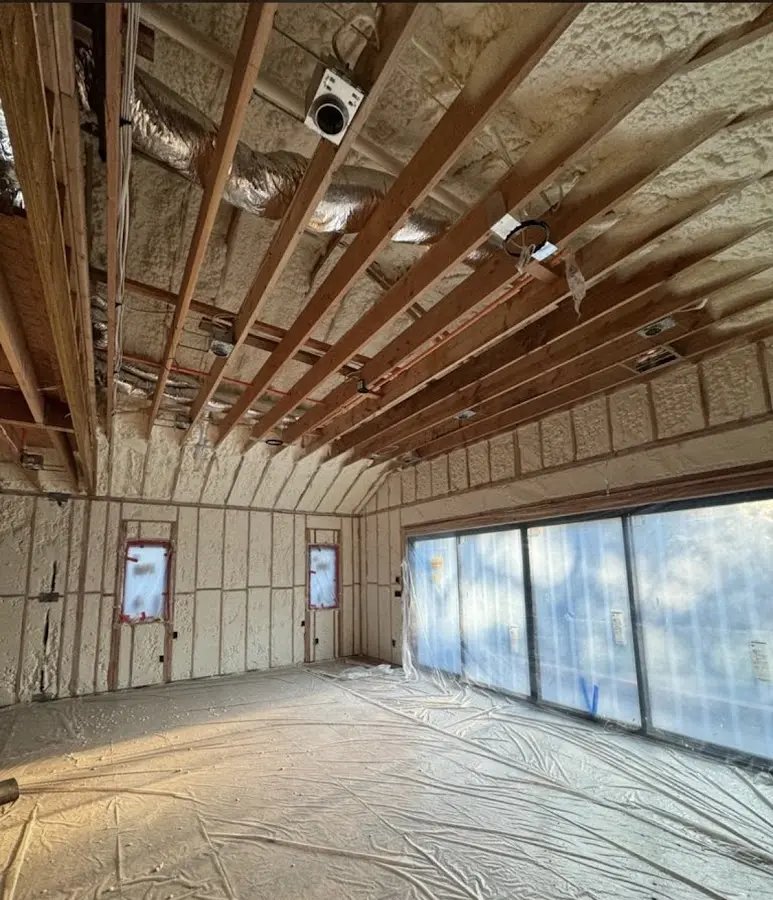 Interior walls and ceiling insulated with spray foam during new construction in Napili-Honokowai